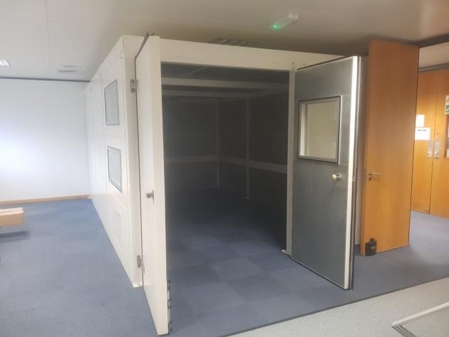 Indoor acoustic enclosure within an educational setting 