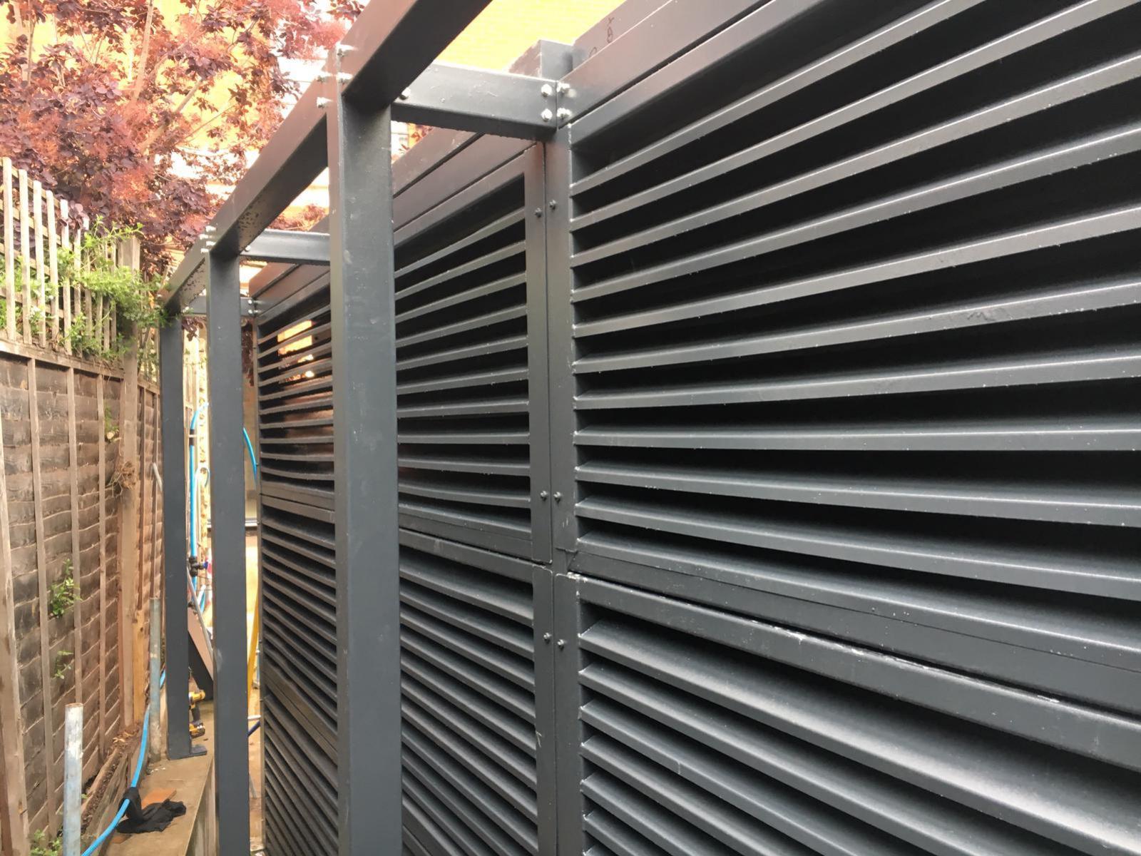 Outdoor noise enclosure with louvres